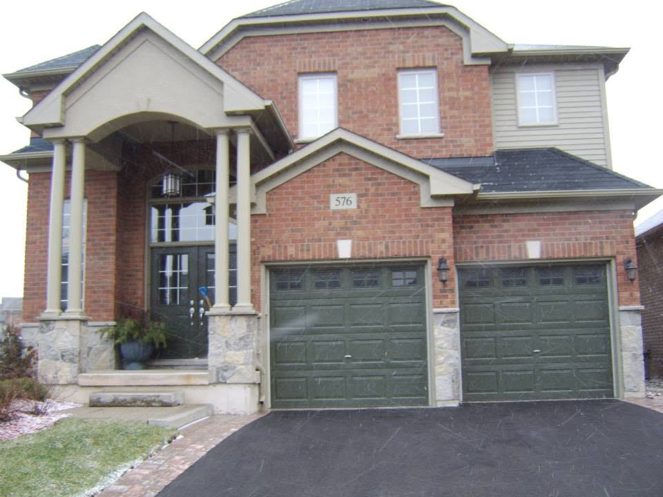 Stone porch base and foundation details below a residential front entrance